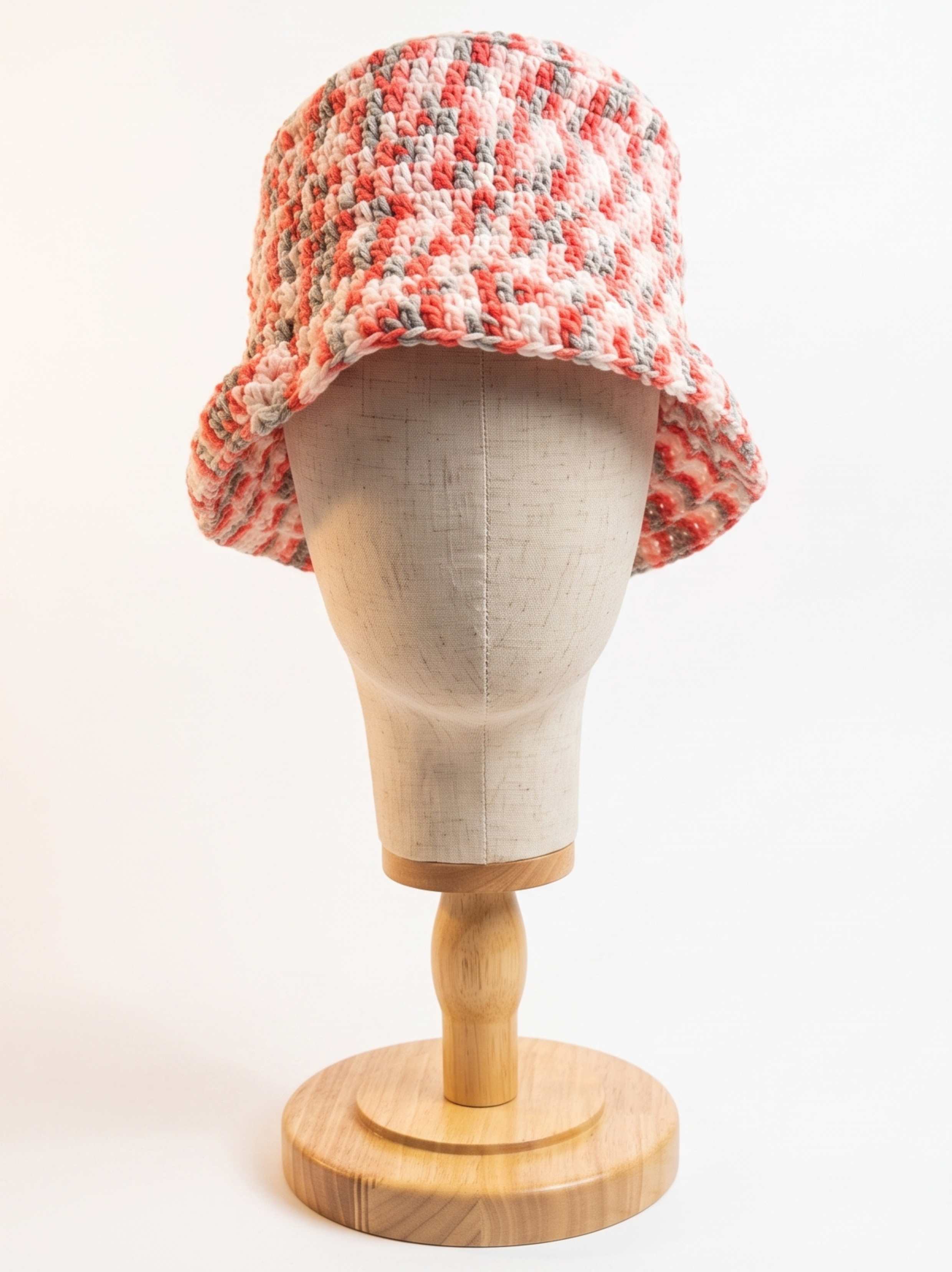 Coral, grey, and cream marled crochet bucket hat