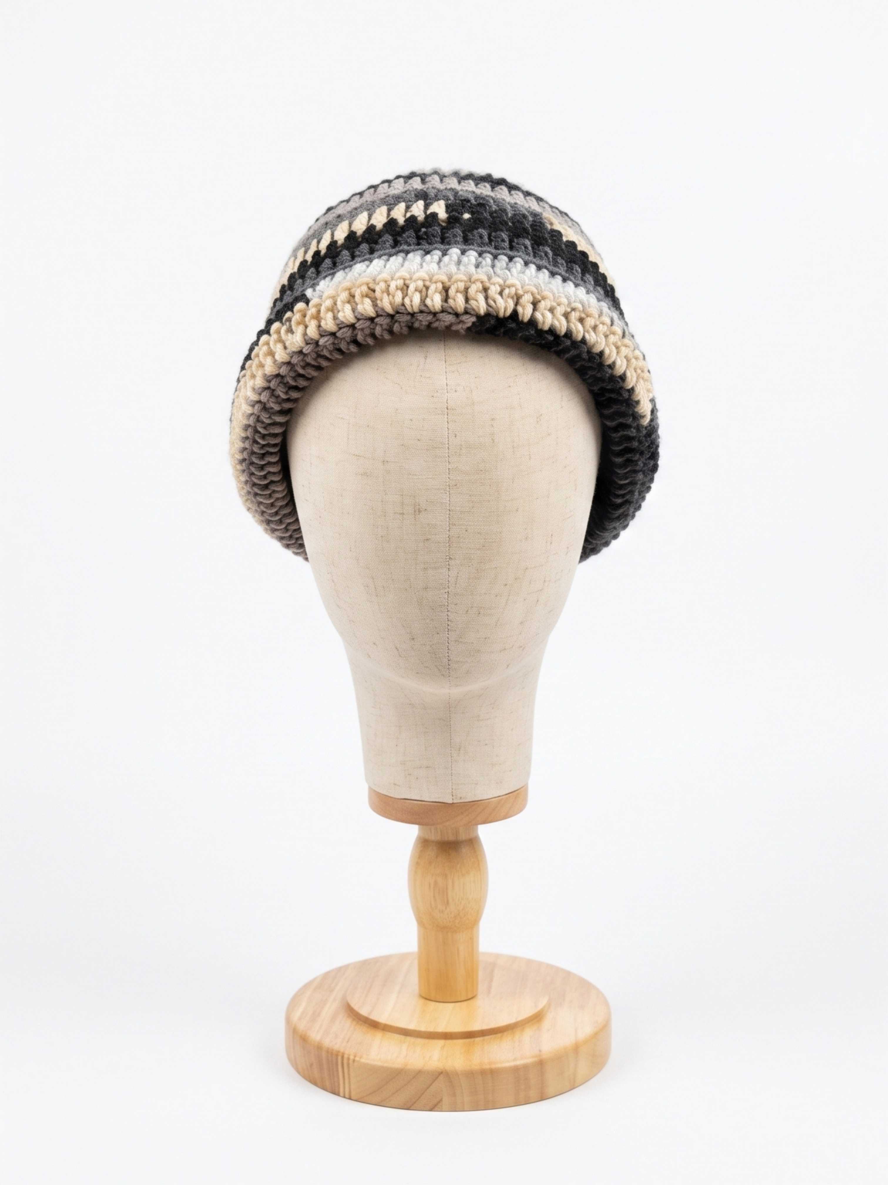 Charcoal, grey, and cream striped crochet rolled-brim bucket hat